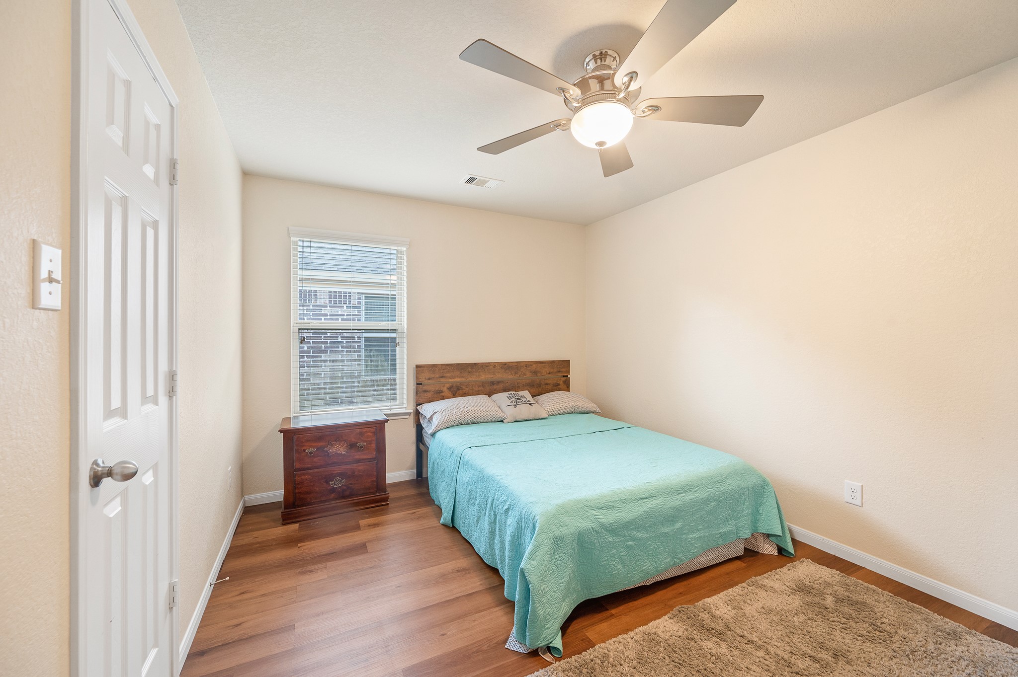 23454 Quarry Path Way Katy, TX 77493 - Photo 15 of 39 a bedroom with a bed and a chandelier