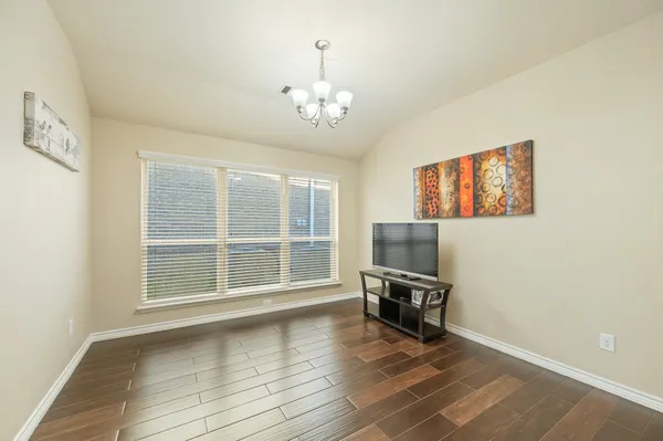 a view of a livingroom with wooden floor