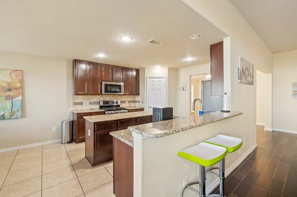 a living room with a bed furniture and a window
