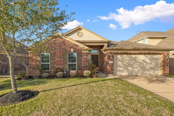 a swimming pool with an outdoor space and seating area