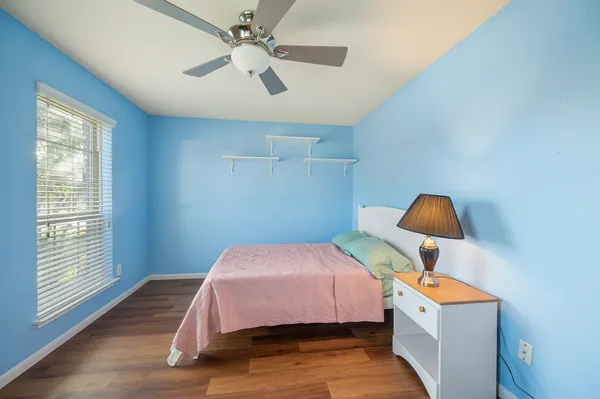 a bedroom with a bed and window