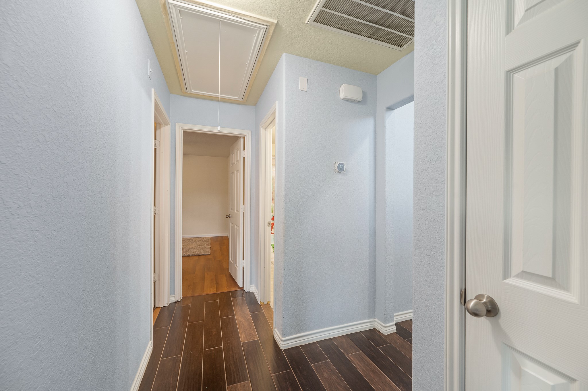 23454 Quarry Path Way Katy, TX 77493 - Photo 10 of 39 a view of a hallway with wooden floor and closet area