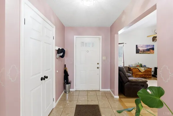 a bedroom with furniture and a wooden floor