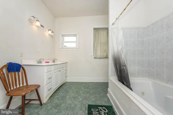 a bathroom with a sink a toilet and a bathtub