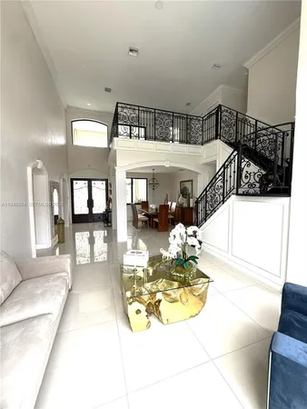 a view of a living room and kitchen