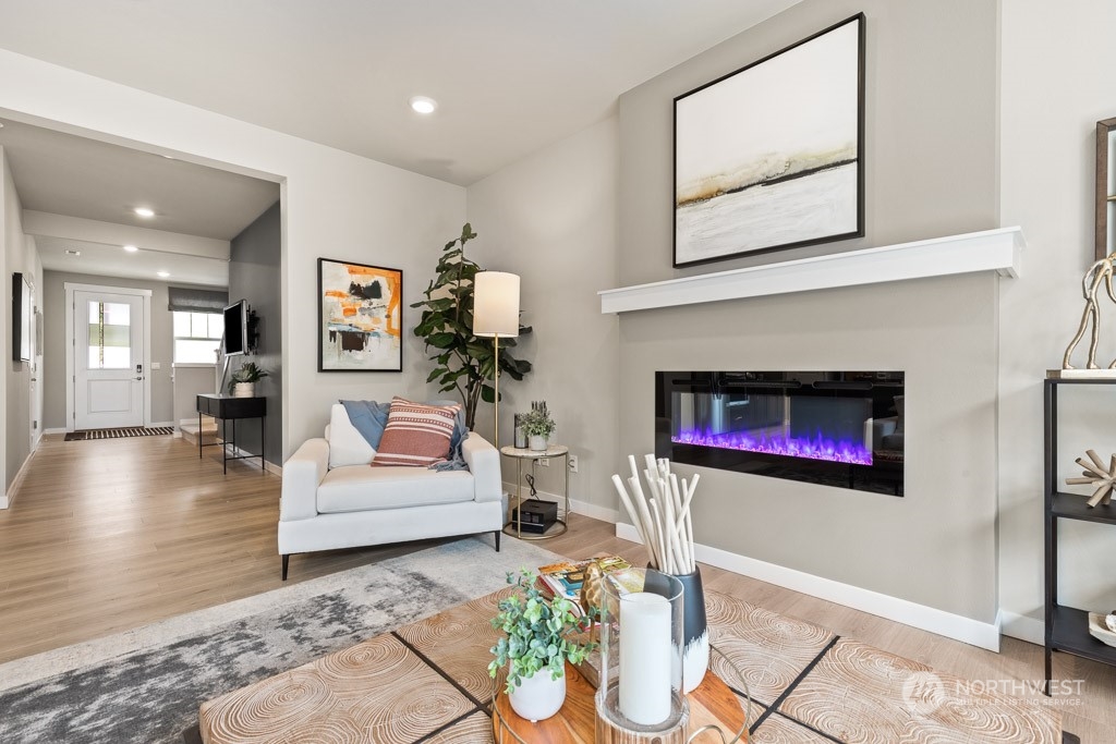 4410 228th Place South East, Unit 6 Bothell, WA 98021 - Photo 12 of 38 a living room with furniture and a fireplace