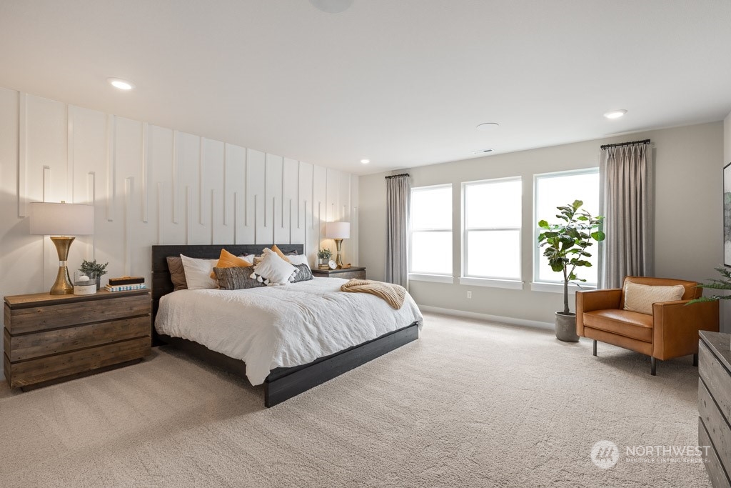 4410 228th Place South East, Unit 6 Bothell, WA 98021 - Photo 23 of 38 a spacious bedroom with a bed and a couch