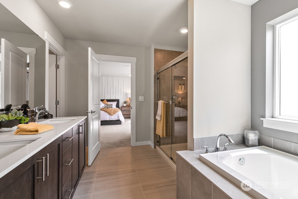 4410 228th Place South East, Unit 6 Bothell, WA 98021 - Photo 29 of 38 a bathroom with a granite countertop sink and a mirror