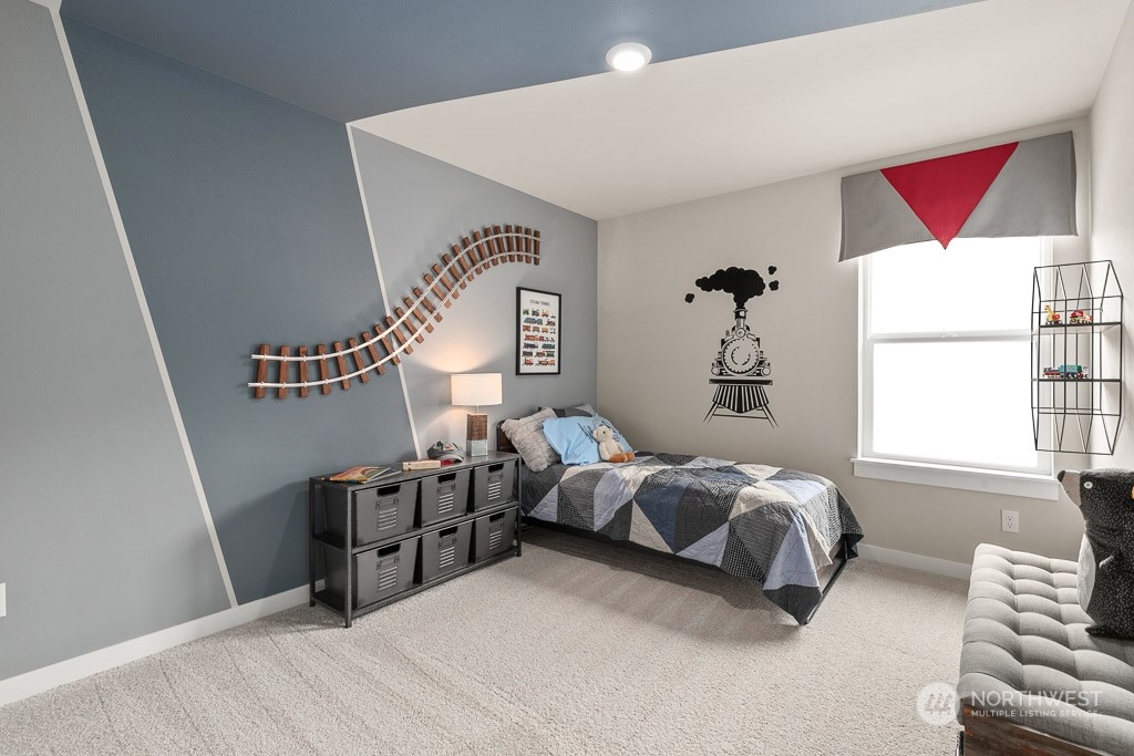 4410 228th Place South East, Unit 6 Bothell, WA 98021 - Photo 33 of 38 a bedroom with furniture and a window