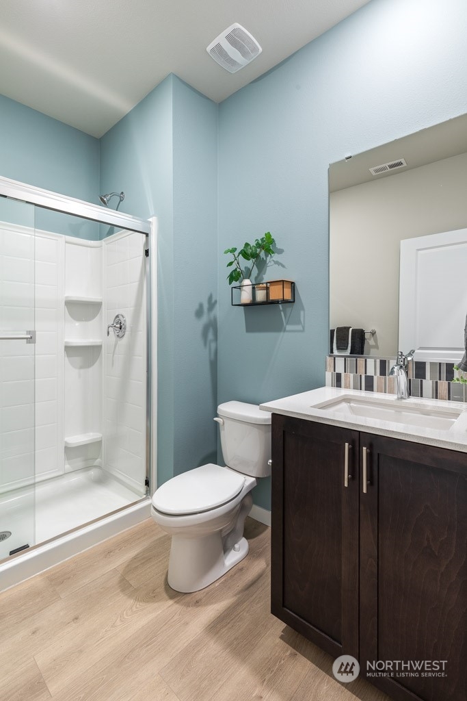 4410 228th Place South East, Unit 6 Bothell, WA 98021 - Photo 7 of 38 a bathroom with a sink toilet and shower