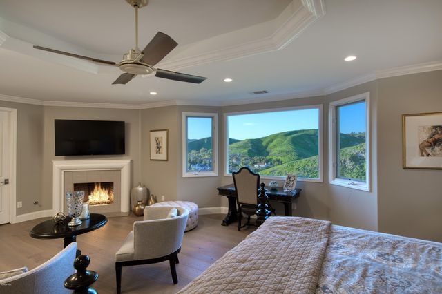 a living room with furniture fireplace and a flat screen tv