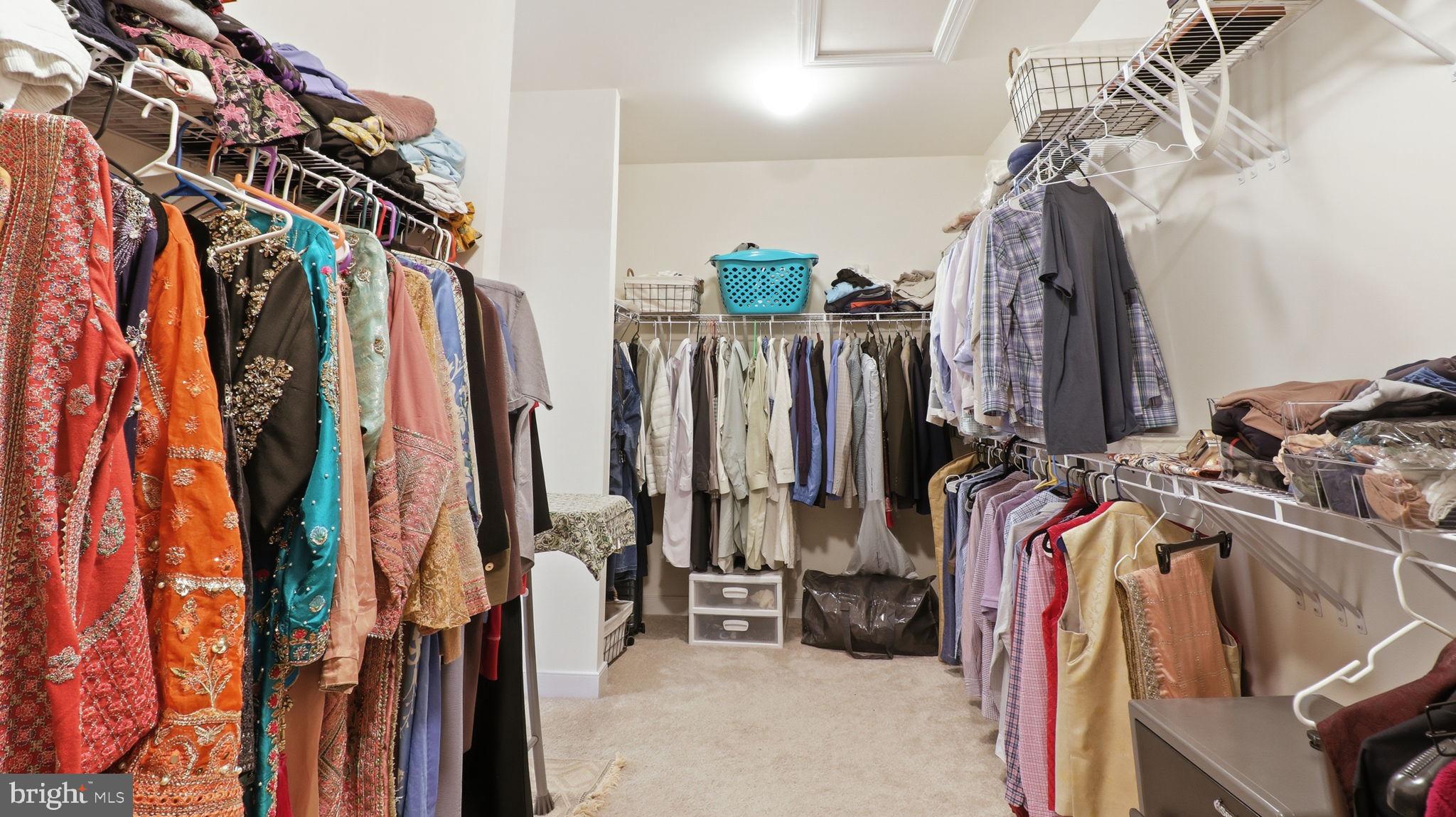11502 Aden Road Nokesville, VA 20181 - Photo 76 of 106 a view of walk in closet with clothes and shoes