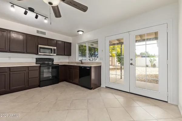 a kitchen with stainless steel appliances granite countertop a stove and a sink