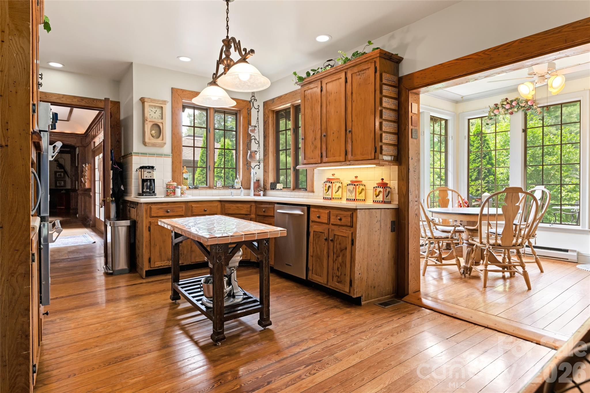 2531 Little River Road Hendersonville, NC 28739 - Photo 11 of 48 a view of a dining room with furniture window and wooden floor