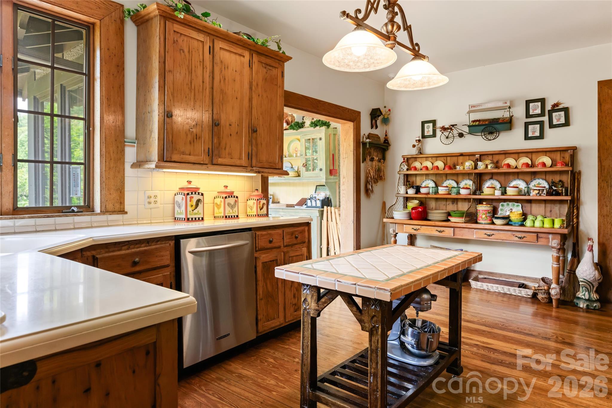 2531 Little River Road Hendersonville, NC 28739 - Photo 12 of 48 a kitchen that has a cabinets counter space and a window