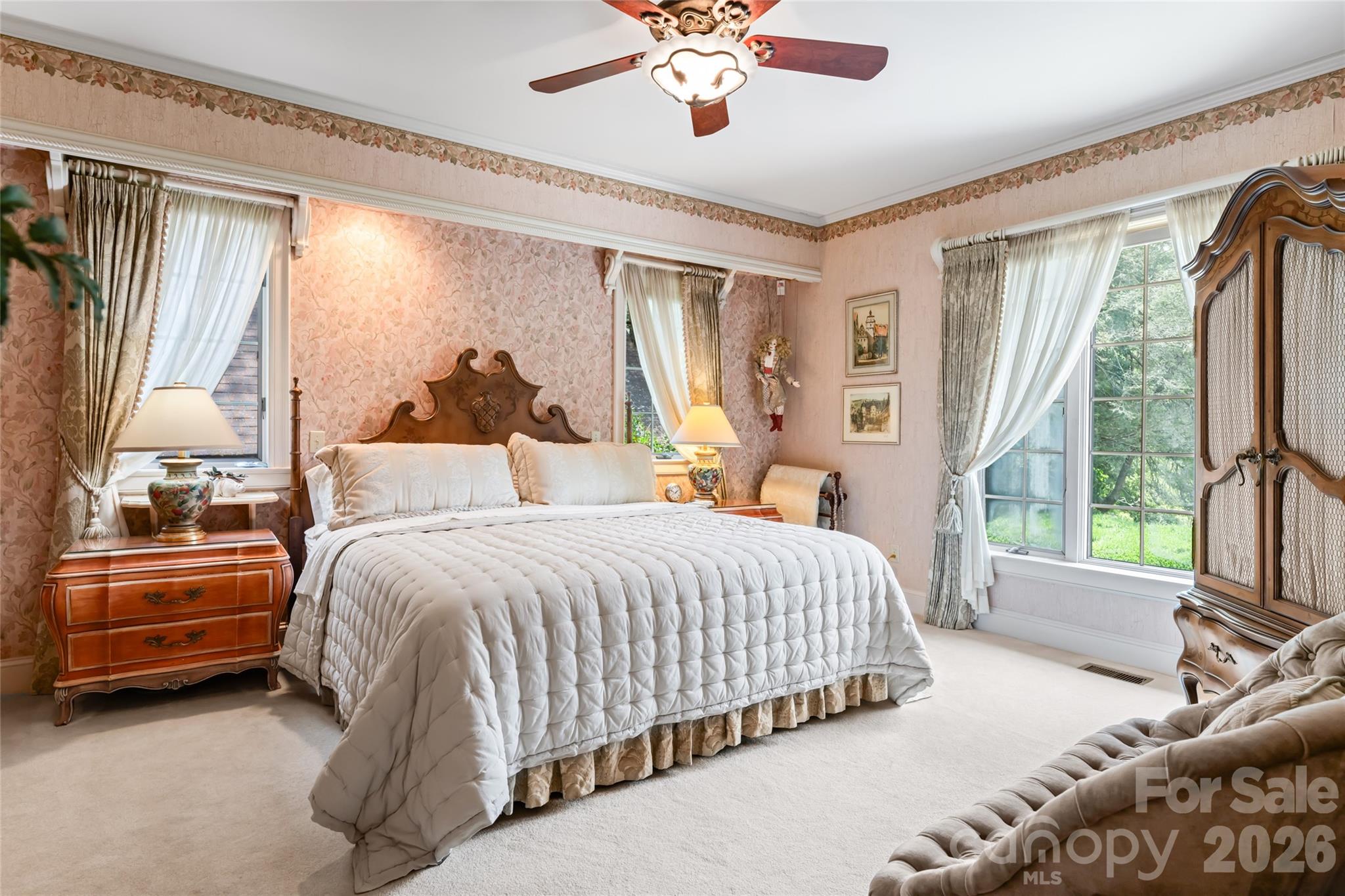 2531 Little River Road Hendersonville, NC 28739 - Photo 16 of 48 a bedroom with a bed and a large window