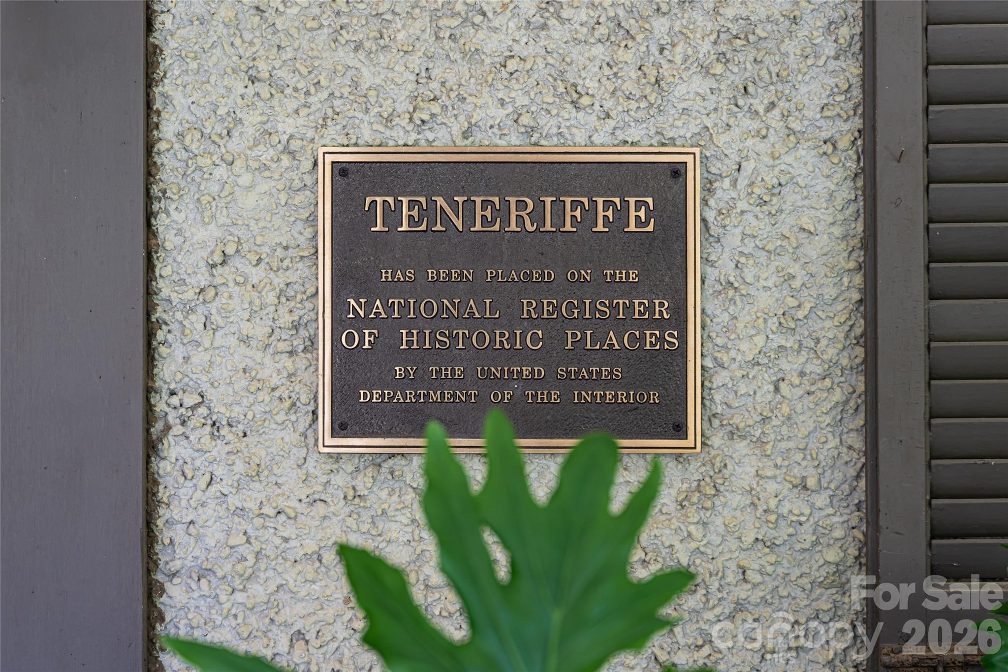 2531 Little River Road Hendersonville, NC 28739 - Photo 2 of 48 a sign that is sitting on a brick wall