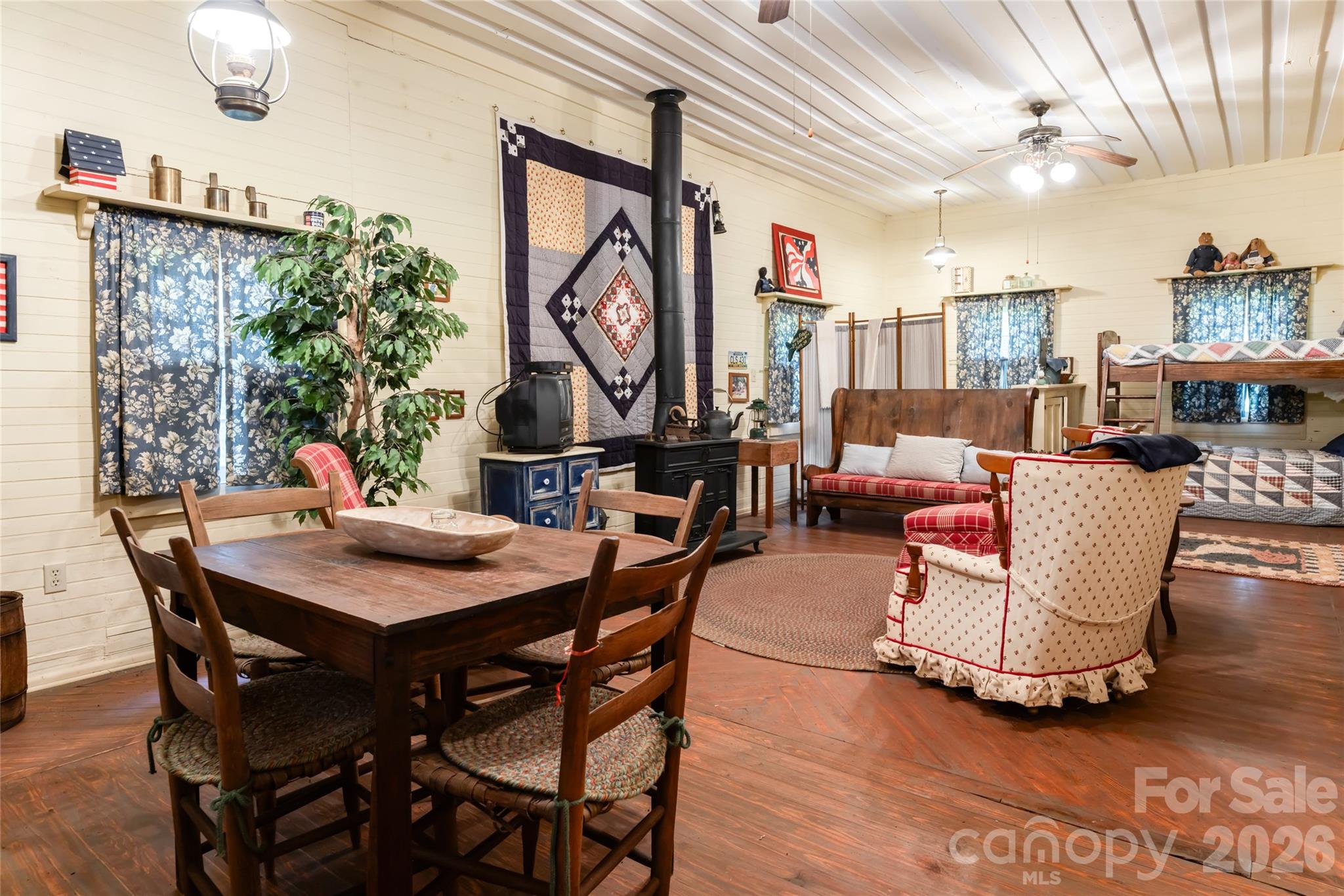 2531 Little River Road Hendersonville, NC 28739 - Photo 33 of 48 a dining room with furniture a rug and wooden floor