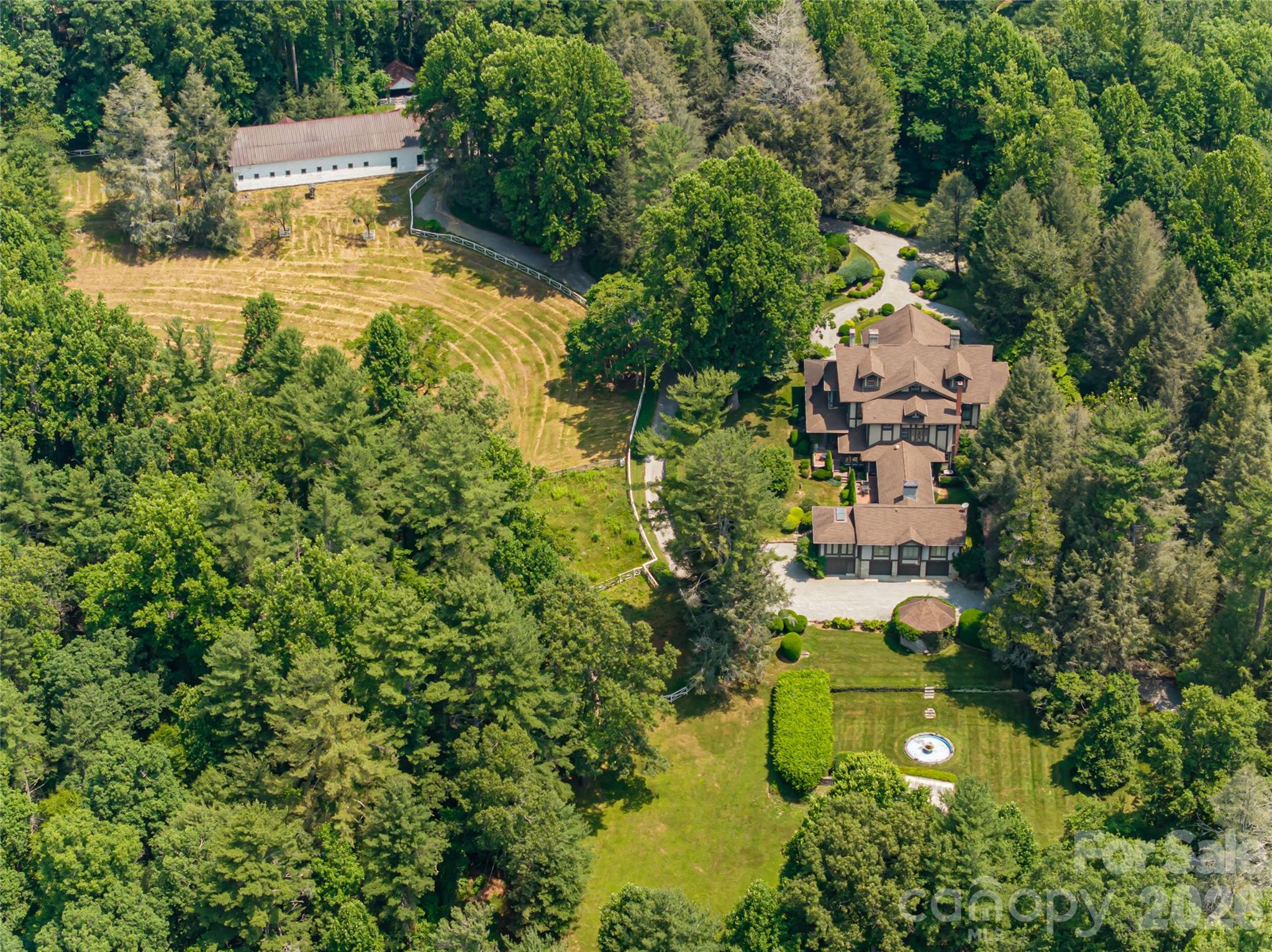 2531 Little River Road Hendersonville, NC 28739 - Photo 34 of 48 an aerial view of residential house with swimming pool and green space