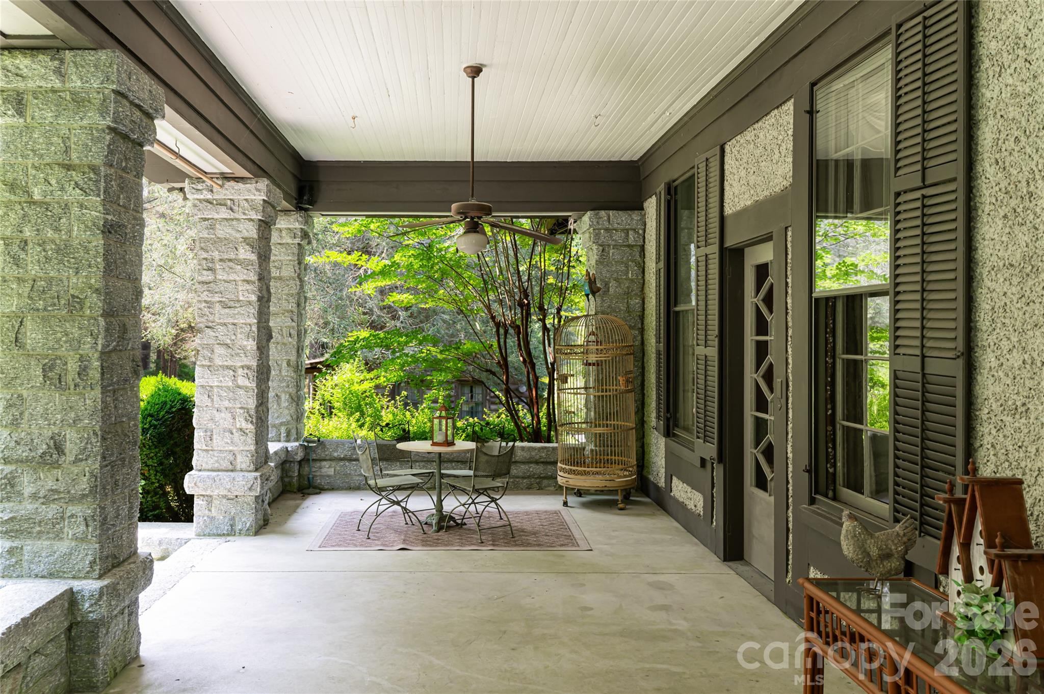 2531 Little River Road Hendersonville, NC 28739 - Photo 37 of 48 a living room filled with furniture and a chandelier