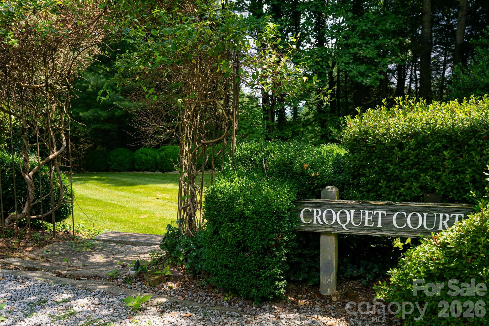 2531 Little River Road Hendersonville, NC 28739 - Photo 41 of 48 a view of a street sign under a large tree