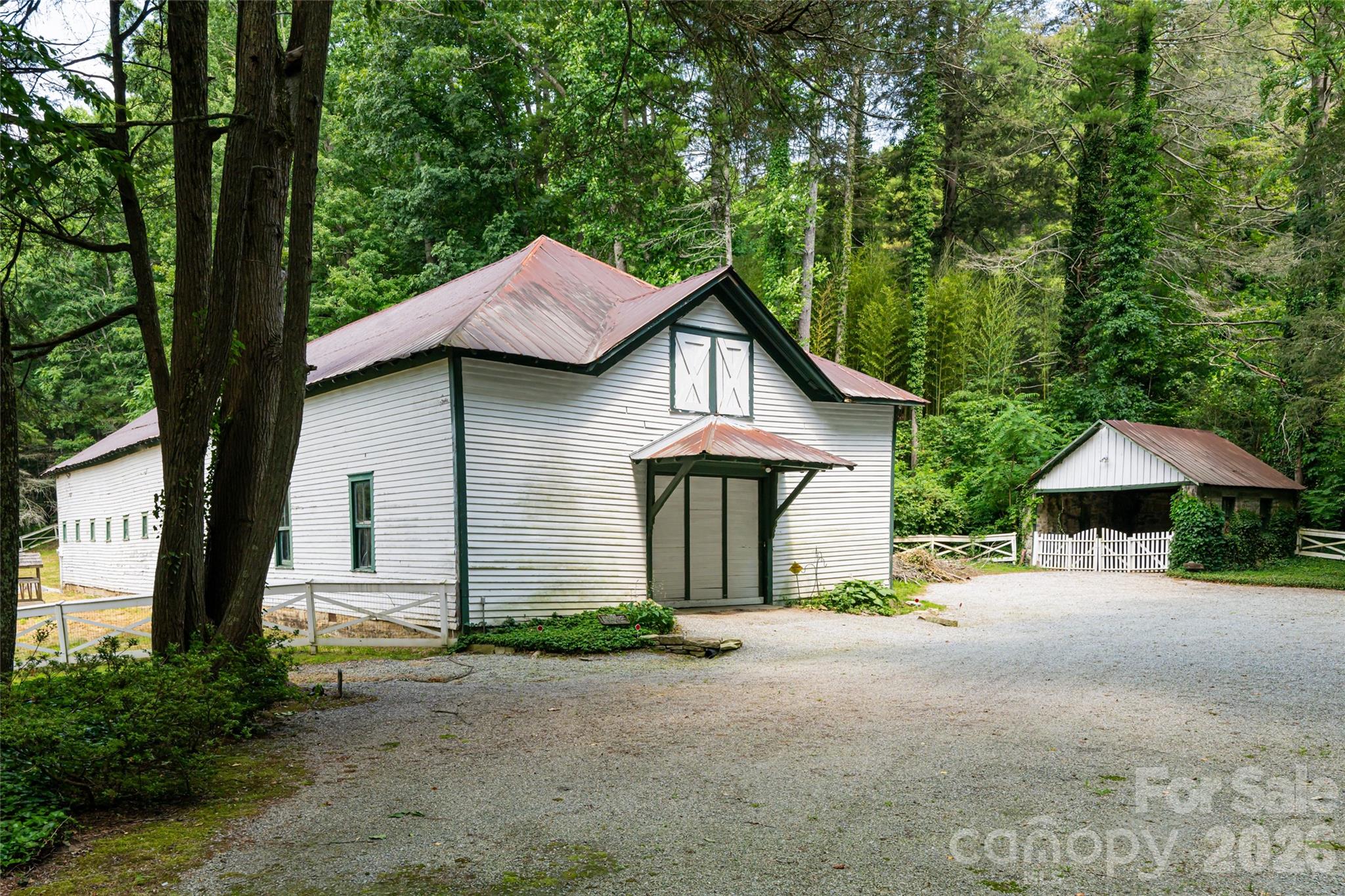 2531 Little River Road Hendersonville, NC 28739 - Photo 45 of 48 a view of a house with backyard and trees