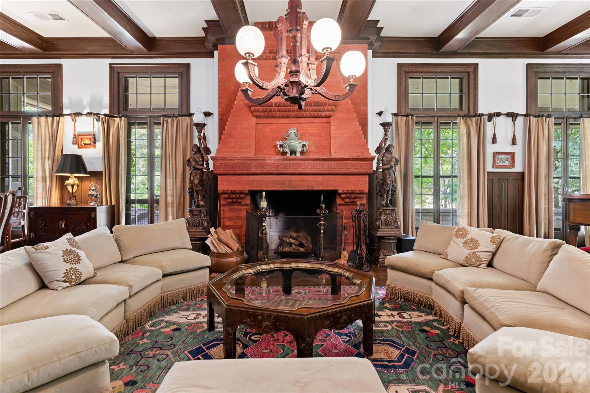 2531 Little River Road Hendersonville, NC 28739 - Photo 9 of 48 a living room with furniture a fireplace and windows