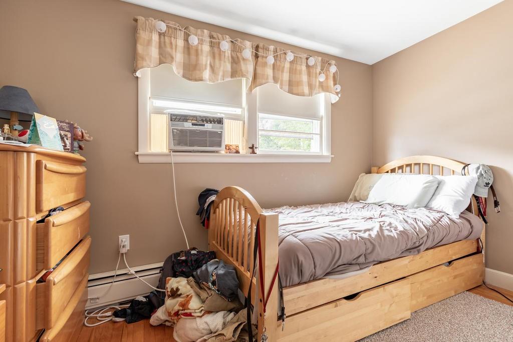 28 Millbrook Road Beverly, MA 01915 - Photo 18 of 29 a bedroom with a bed and wooden floor