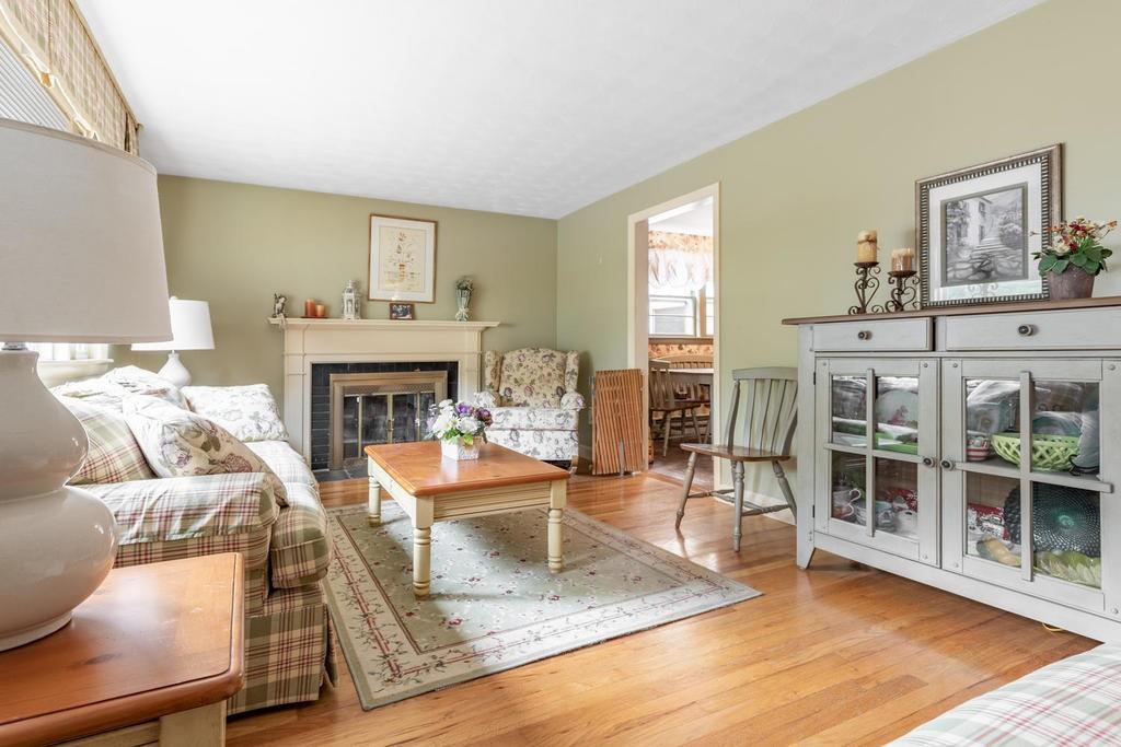 28 Millbrook Road Beverly, MA 01915 - Photo 4 of 29 a living room with furniture large window and a fireplace