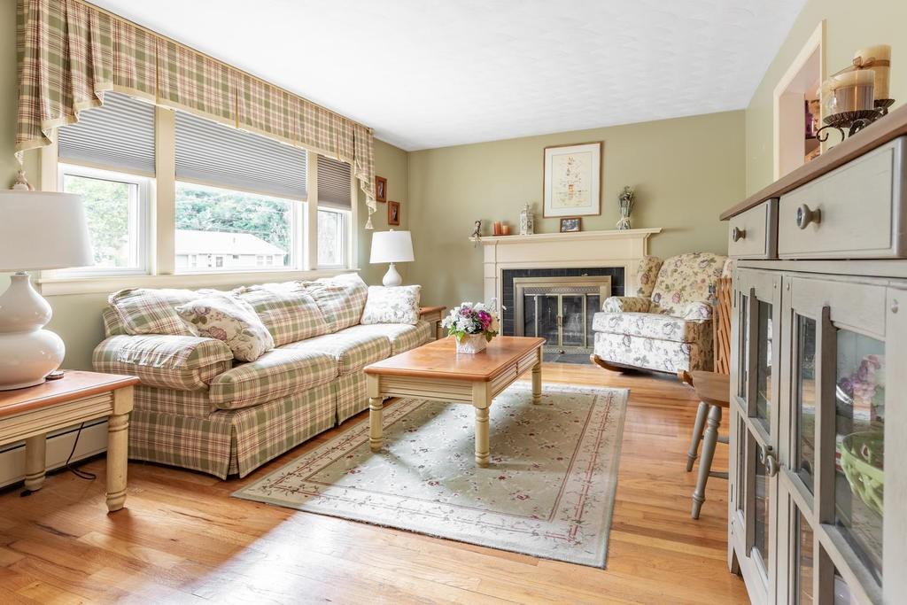 28 Millbrook Road Beverly, MA 01915 - Photo 5 of 29 a living room with furniture a fireplace and a large window