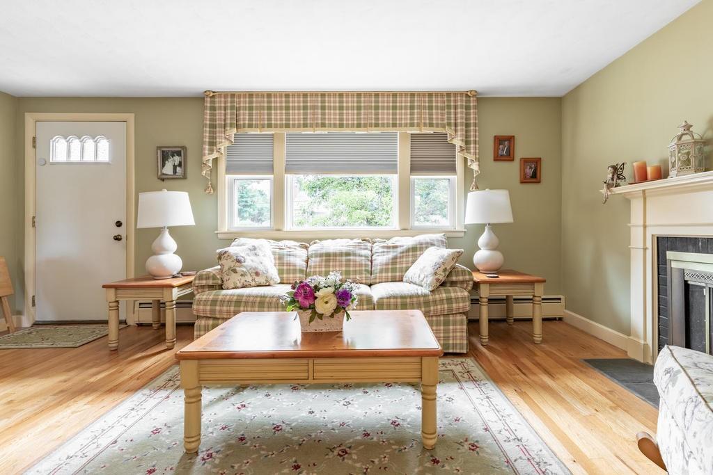 28 Millbrook Road Beverly, MA 01915 - Photo 6 of 29 a living room with furniture a fireplace and a table