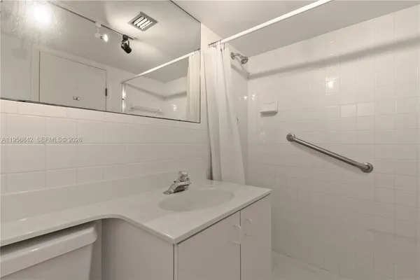 a bathroom with a sink and a shower