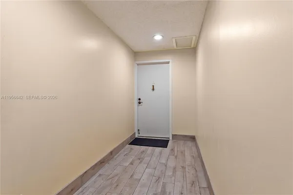 a view of a small space with wooden floor