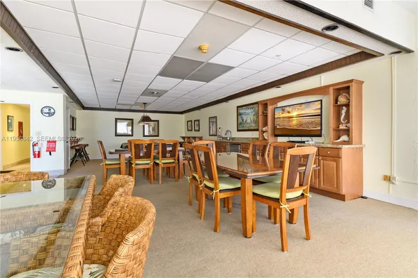 a living room with lots of furniture and a chandelier
