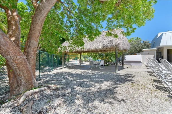 a view of a backyard with a sitting area and furniture