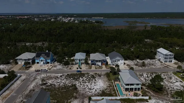 a view of residential houses with car parked
