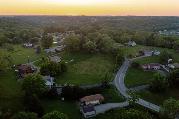 an aerial view of a house with a garden