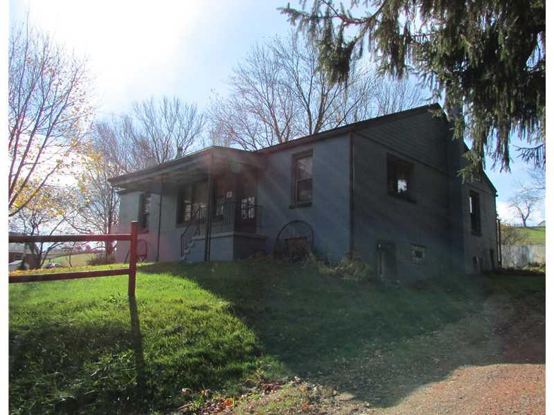 261 Little Blue Road Georgetown, PA 15043 - Photo 2 of 7 Exterior Front. FRONT/SIDE VIEW. FRONT COVERED PORCH. WALK OUT BASEMENT.