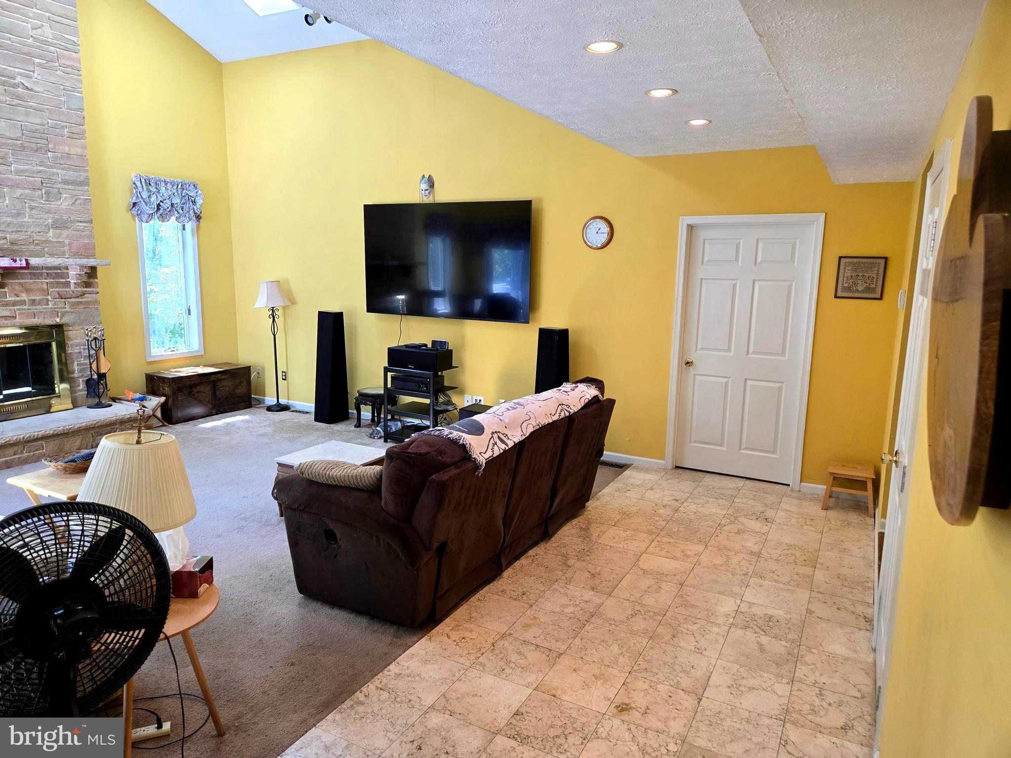 3314 Charles Street Fallston, MD 21047 - Photo 21 of 26 a living room with furniture and a flat screen tv