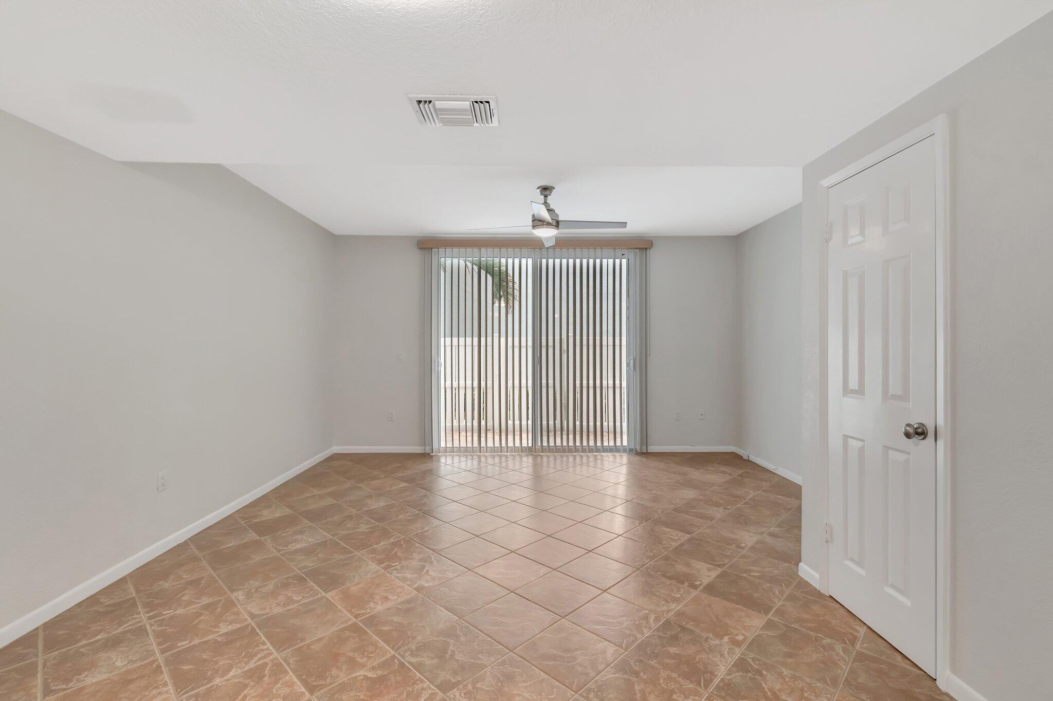 1016 Jeffery Street, Unit 1016 Boca Raton, FL 33487 - Photo 12 of 65 a view of an empty room with a window