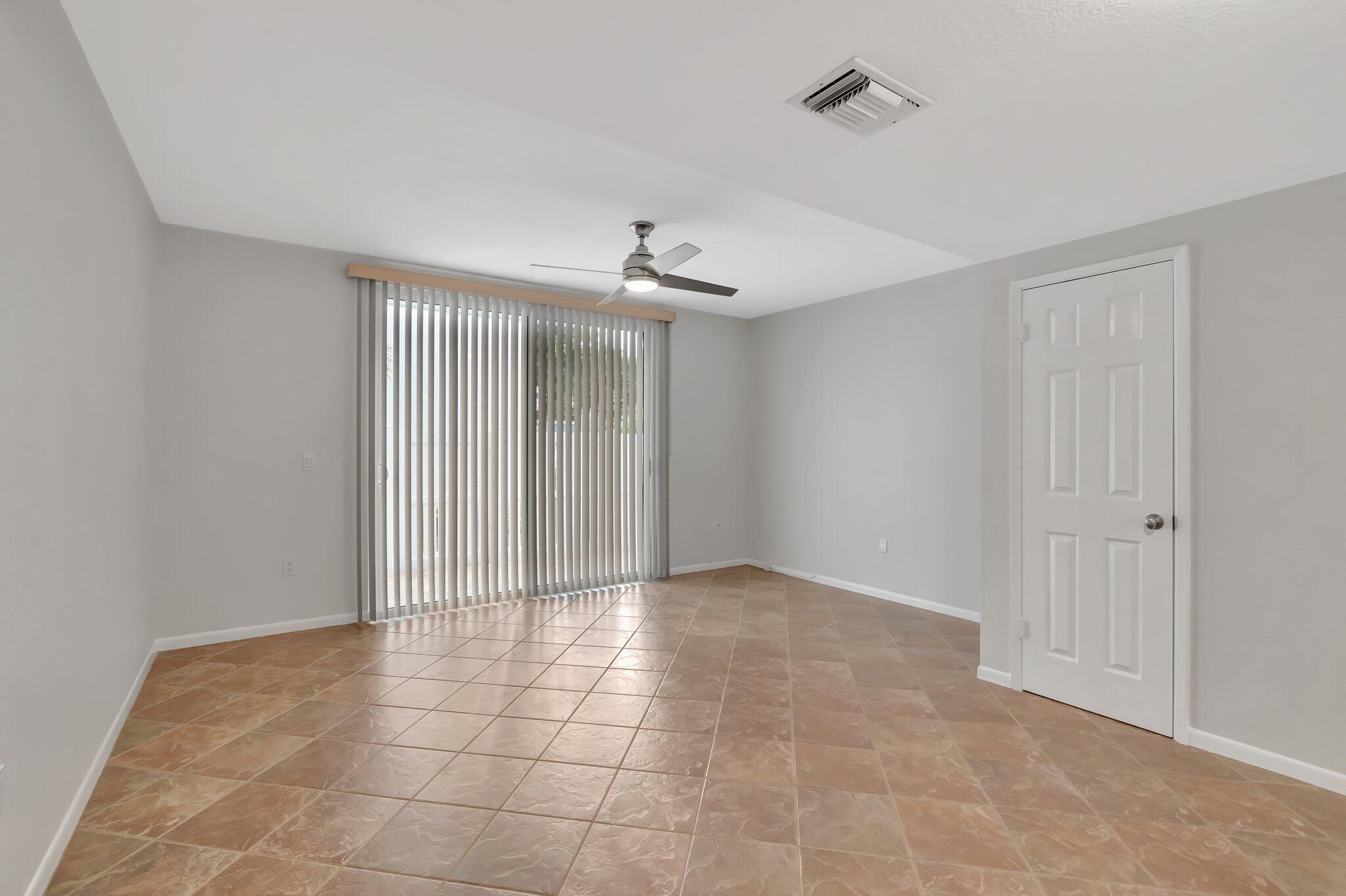1016 Jeffery Street, Unit 1016 Boca Raton, FL 33487 - Photo 13 of 65 a view of an empty room with a window
