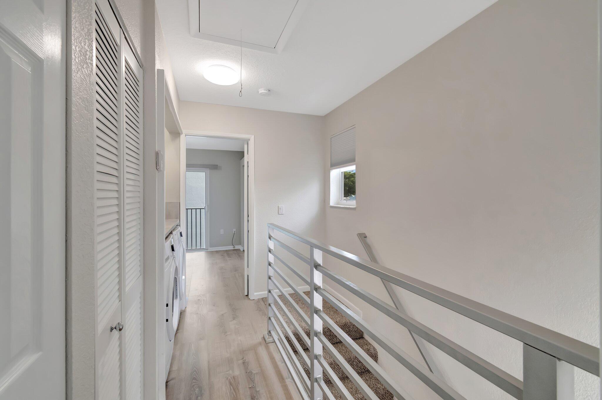 1016 Jeffery Street, Unit 1016 Boca Raton, FL 33487 - Photo 26 of 65 a view of a hallway with wooden floor and staircase