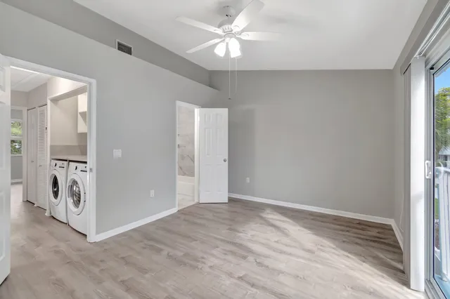 wooden floor in an empty room with a window