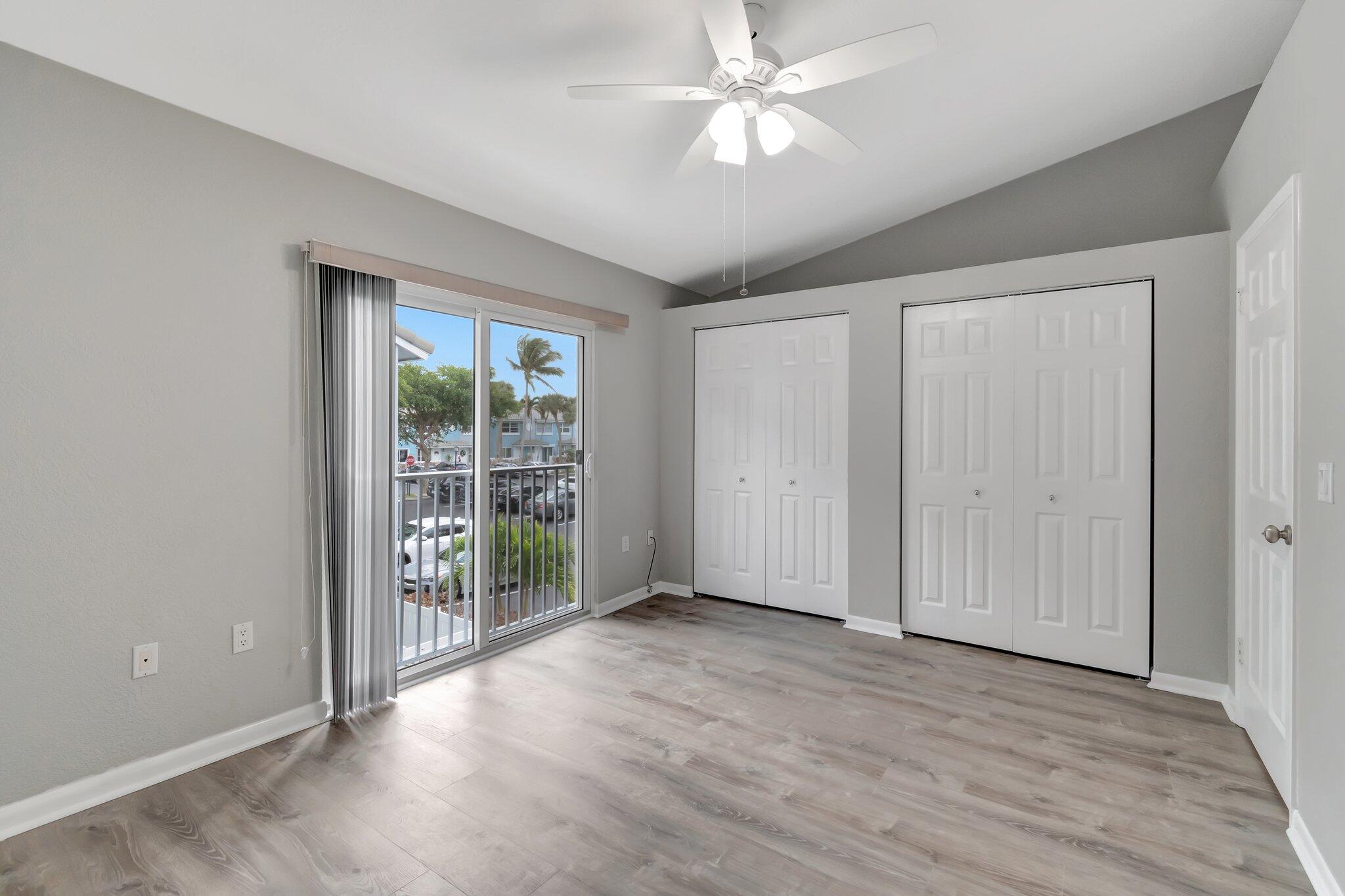 1016 Jeffery Street, Unit 1016 Boca Raton, FL 33487 - Photo 31 of 65 wooden floor in an empty room with a window