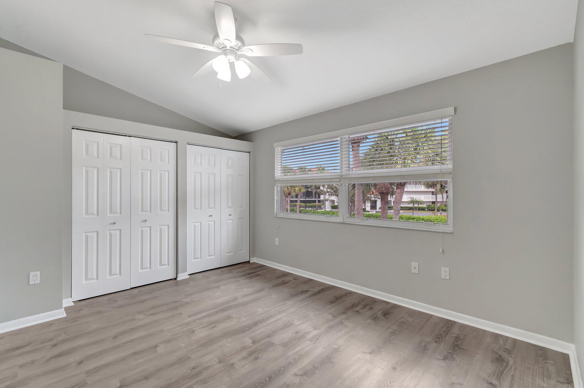 1016 Jeffery Street, Unit 1016 Boca Raton, FL 33487 - Photo 36 of 65 wooden floor in an empty room with a window