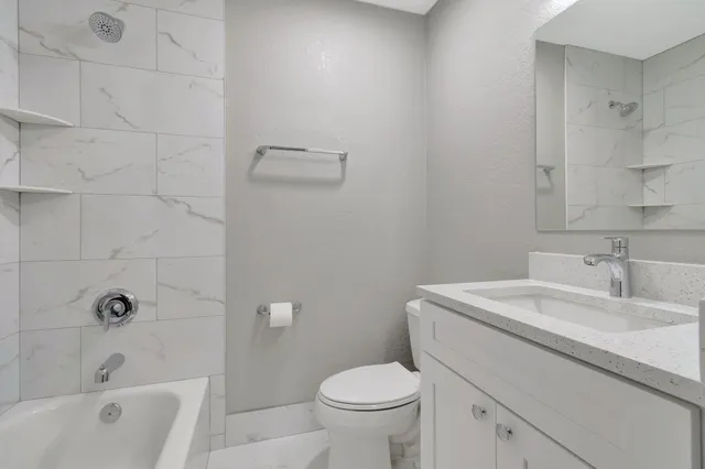 a front view of a house with a yard and a fountain