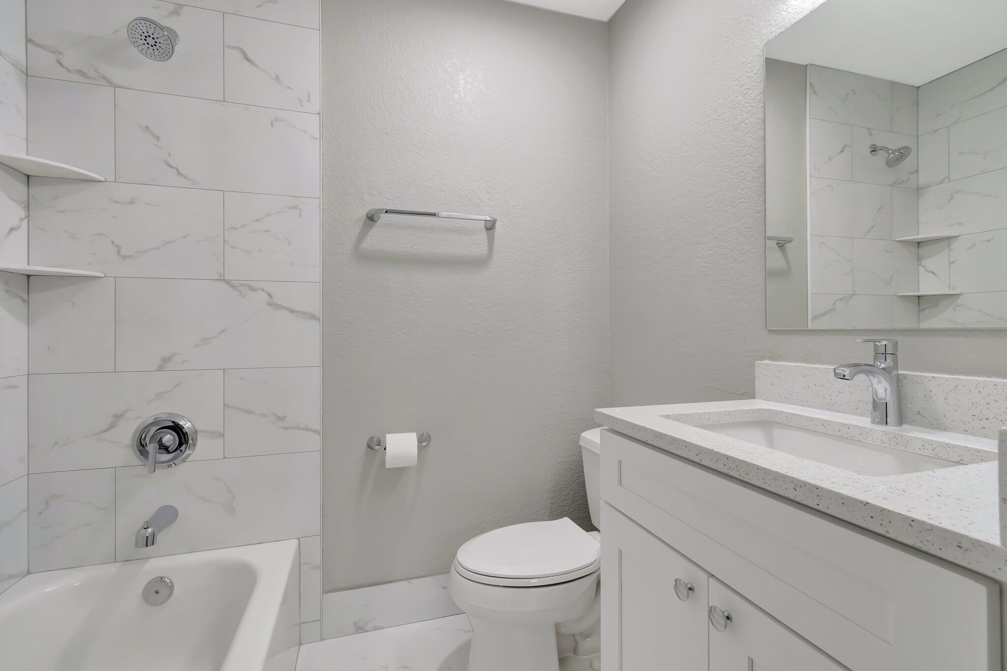 1016 Jeffery Street, Unit 1016 Boca Raton, FL 33487 - Photo 37 of 65 a bathroom with a sink toilet and bathtub