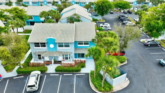 an aerial view of residential houses with outdoor space