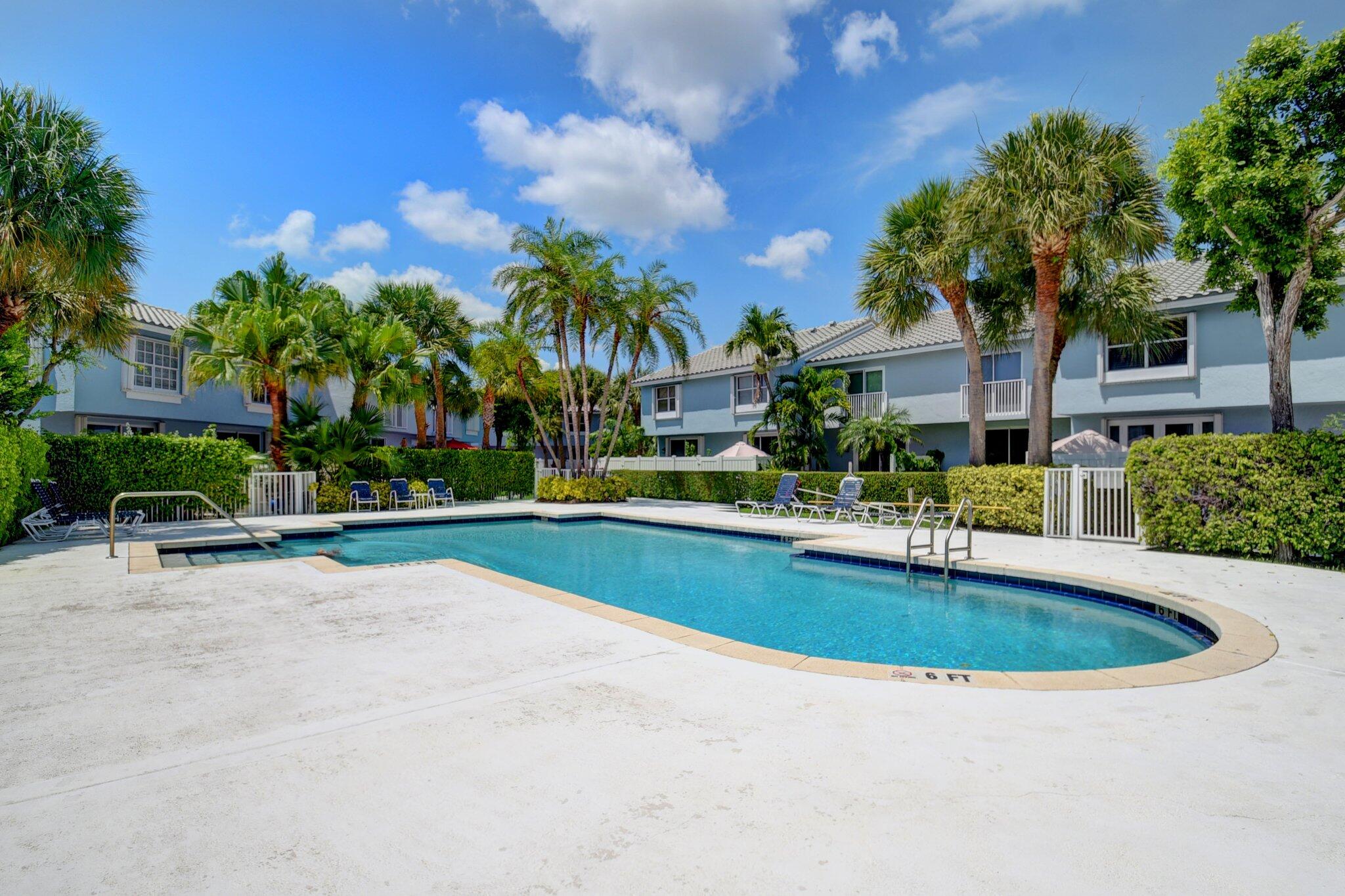 1016 Jeffery Street, Unit 1016 Boca Raton, FL 33487 - Photo 64 of 65 a view of a house with swimming pool and sitting area