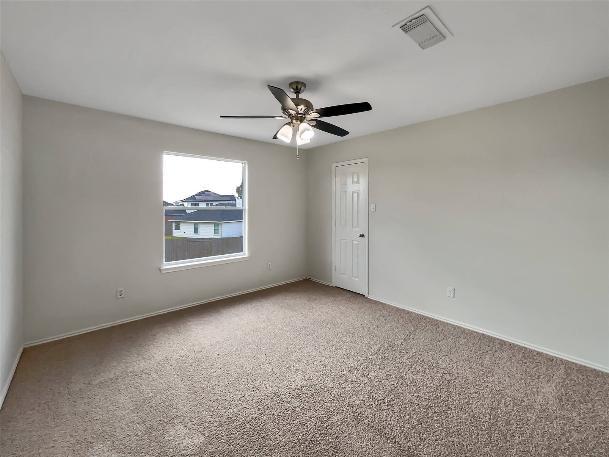 2618 Balsam Ridge Way Fresno, TX 77545 - Photo 15 of 20 an empty room with windows and fan
